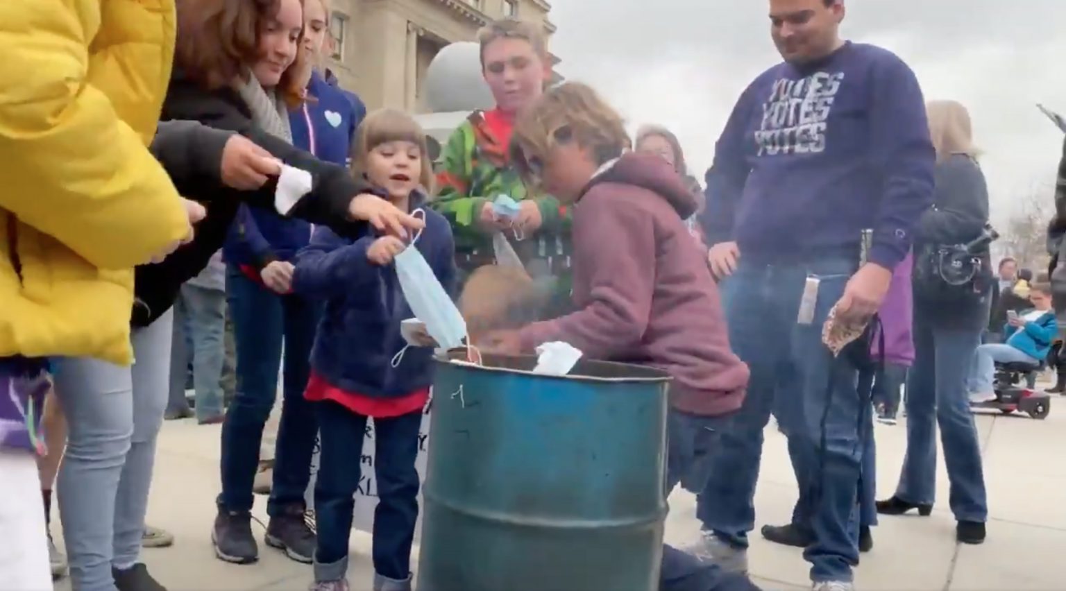 Families Burn Masks outside of Idaho Capitol Steps. March 6, 2021.