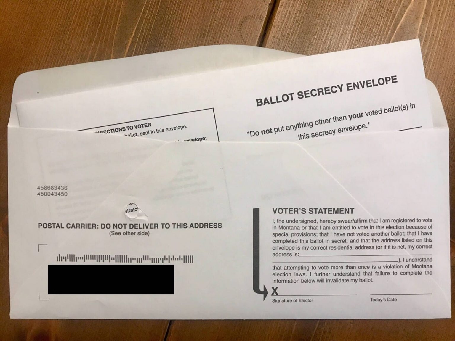 Every mail-in ballot must be placed inside of a signed ballot signature envelope. The signature on the envelope is checked against the voters registration application to verify the voters identity.