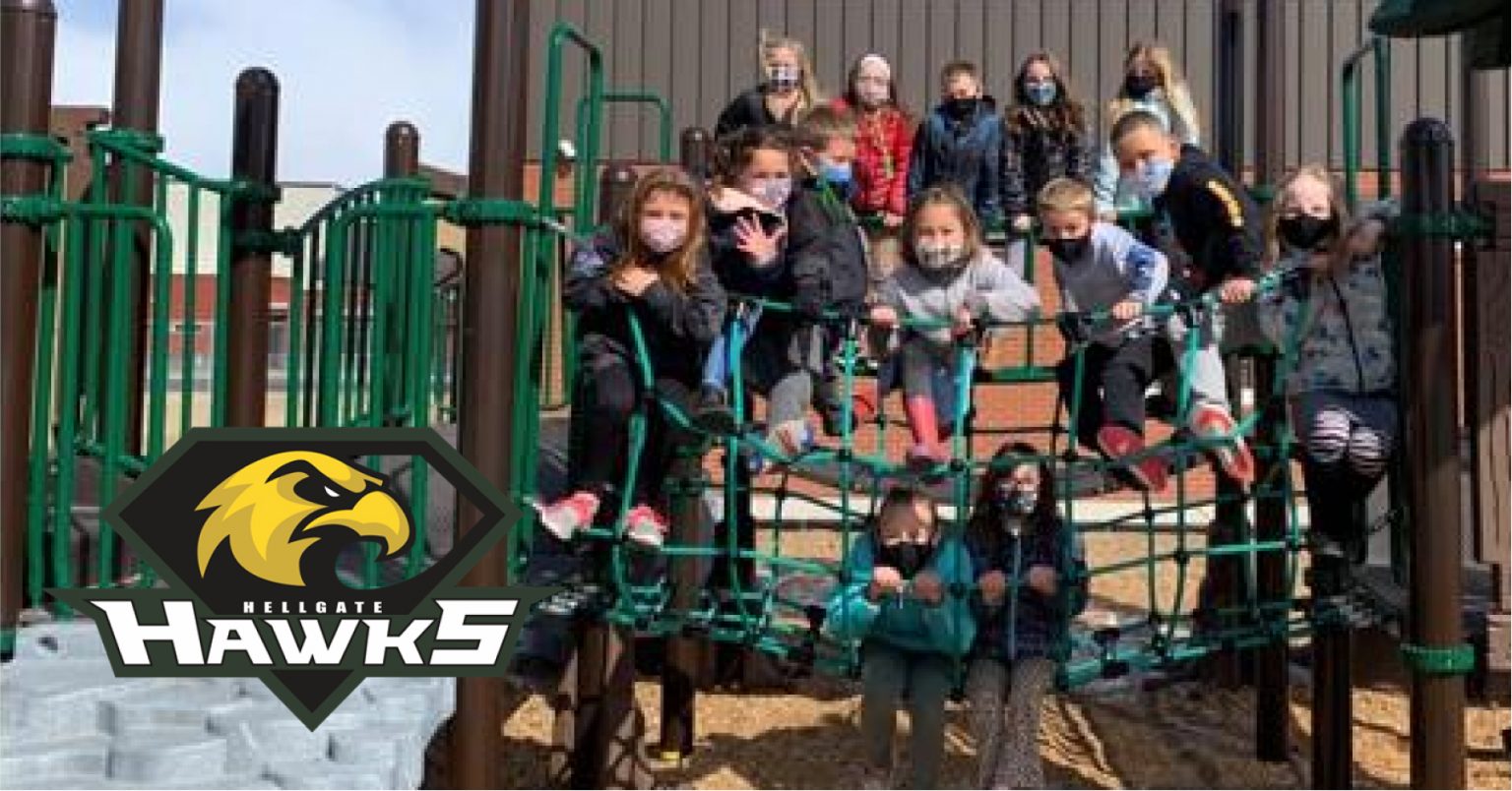 Hellgate Elementary School students pose for photo wearing masks outside. Hellgate Elementary Website.