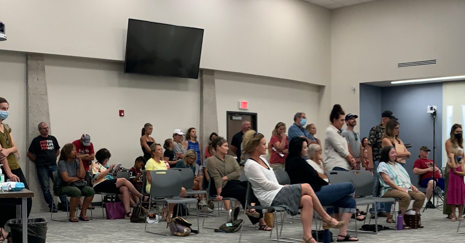 Parents stand for public comment during Missoula County Public Schools "COVID Task Force" meeting.