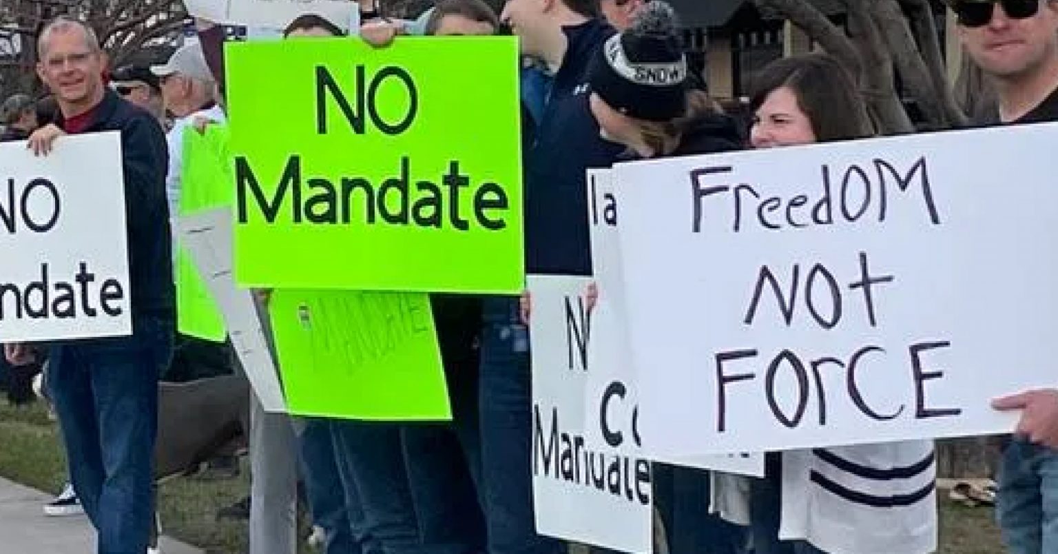 Missoulians lined up in support of healthcare workers at a rally against vaccine mandates on North Reserve Street Saturday, November 28, 2021.