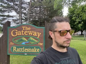 Sign in Sergeant Don Gregory Park that reads, "The Gateway To The Rattlesnake".