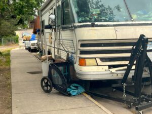 Many people in vehicles lined up on Hawthorne Street behind The Poverello Center have been camping at the intersection of Pine for over a year.